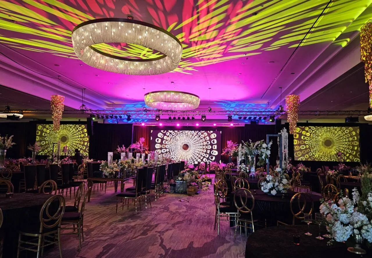 Tampa event design with colored lighting and draped ceiling
